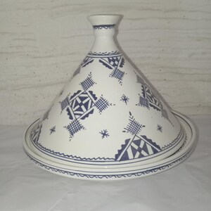 The Authentic Moroccan Tajine: A time-honored cooking pot that embodies centuries of culinary tradition, this handmade ceramic wonder is more than just kitchenware. With its distinctive conical lid and intricate hand-painted designs,