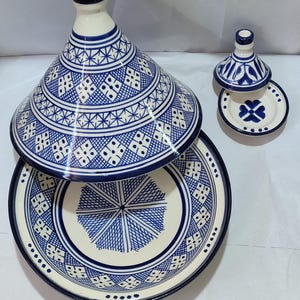 Immerse yourself in Moroccan culinary traditions with this exceptional ceramic tagine. The visually striking domed lid and patterned body in a classic blue and white color palette make this Moroccan cookware piece a beautiful addition to any kitchen.