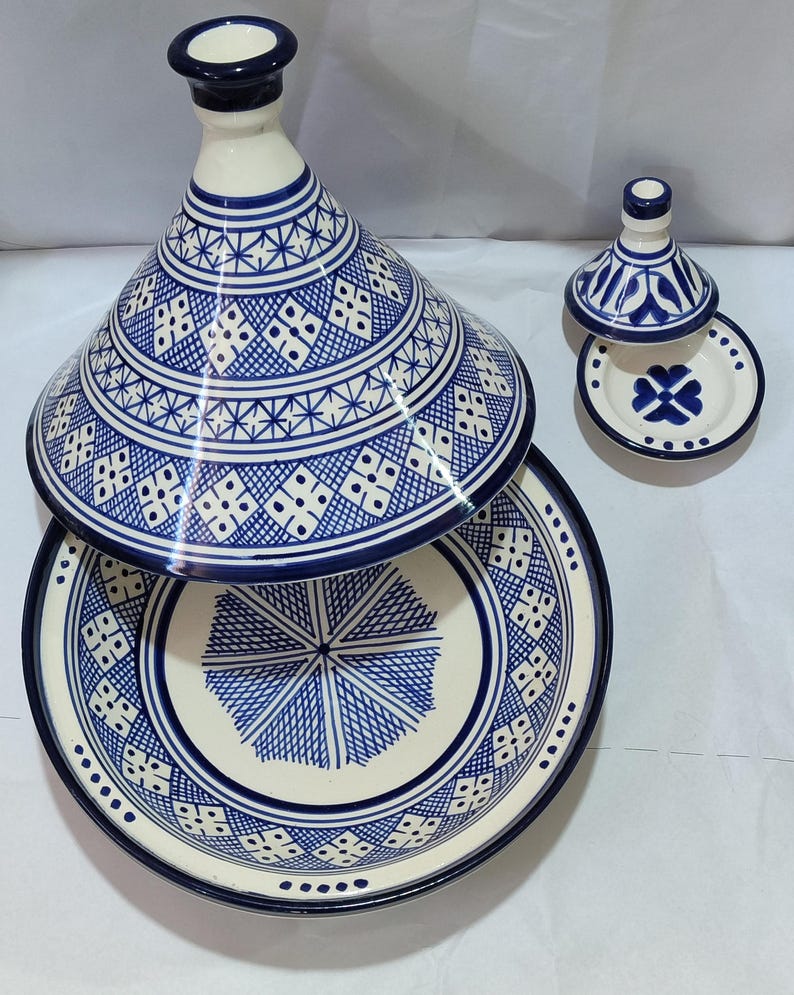 Immerse yourself in Moroccan culinary traditions with this exceptional ceramic tagine. The visually striking domed lid and patterned body in a classic blue and white color palette make this Moroccan cookware piece a beautiful addition to any kitchen.