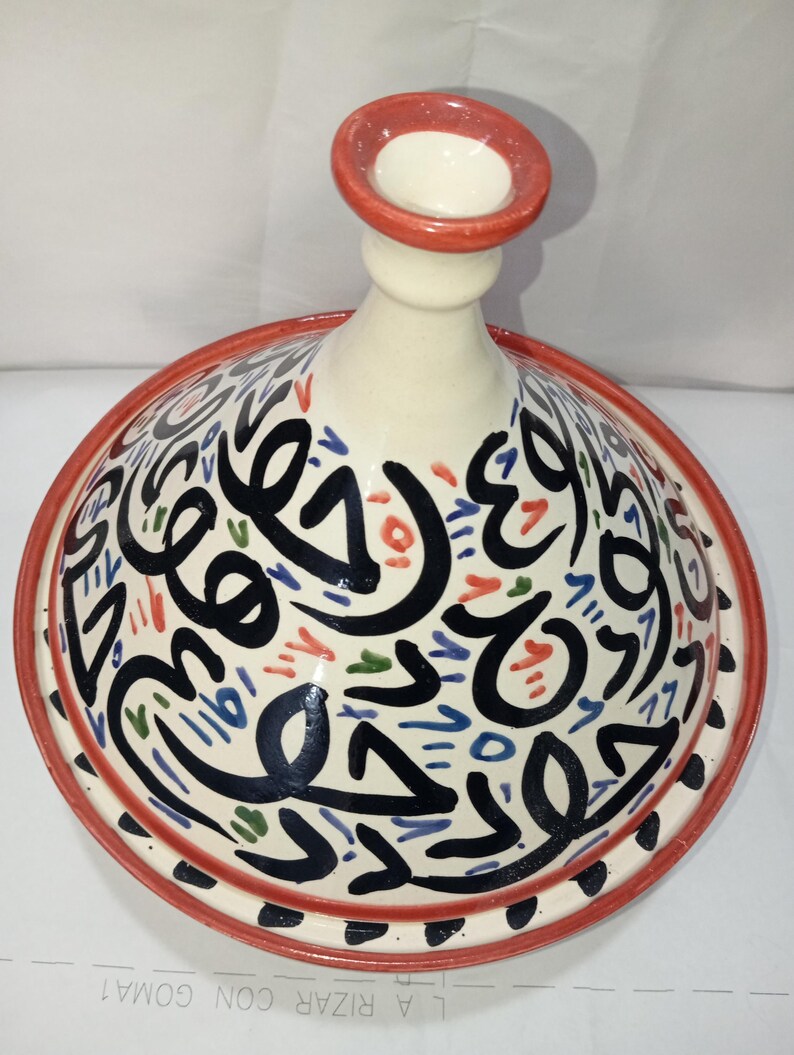 Discover the authentic way to cook with our handmade ceramic tagine. Perfect for slow-cooked meals that are flavorful, tender, and packed with tradition. designed to lock in moisture and flavor for a true culinary experience.