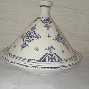 Antique-Style Moroccan Tajine: A magnificent representation of traditional kitchenware, this handmade ceramic pot embodies the soul of Moroccan cooking. Its unique design allows for slow, even cooking that preserves the natural flavors