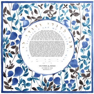 May include: A watercolor ketubah with a blue and gray floral design. The ketubah is a Jewish marriage contract and features the Hebrew text "And my beloved is mine and I am his." The text also includes the names Victoria and Adam, the date October 20, 2018, and the location Brookfield, CT.
