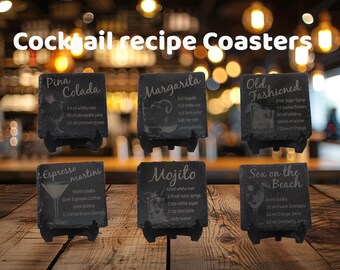 May include: Six black slate coasters with recipes for popular cocktails, including Pina Colada, Margarita, Old Fashioned, Espresso Martini, Mojito, and Sex on the Beach. Each coaster has a small stand.