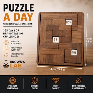Peut inclure: Calendrier puzzle en bois avec le texte "PUZZLE A DAY". Le puzzle marron mesure 14 cm de large et 16 cm de haut. Il affiche la date "17", le mois "NOV" et le jour "TUE". Le calendrier est en bois dur de qualité supérieure.