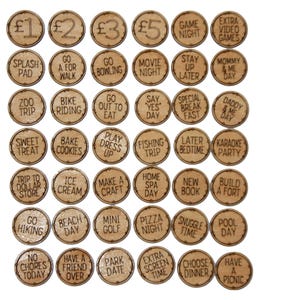 May include: A set of 25 wooden tokens with various activities and rewards written on them. The tokens are circular and have a light brown colour. Some of the activities include "Go Bowling", "Movie Night", "Stay Up Later", "Daddy & Me Day", "Have a Friend Over", and "Have a Picnic".