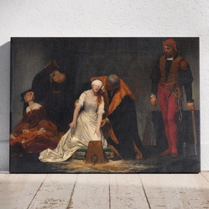 May include: A painting depicting a scene from a historical event. A woman in a white dress and a blindfold is kneeling on the ground. A man in a dark robe is standing over her, while another man in red and black clothing stands to the right. The woman is surrounded by other figures in the background.