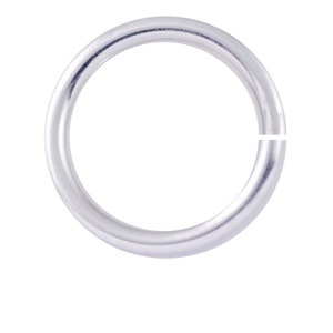 May include: A silver jump ring, a metal ring with a gap, used for jewelry making.