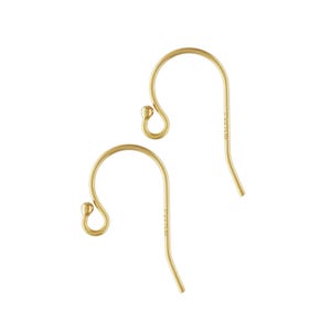 May include: A pair of gold-toned earring hooks. The hooks are made of metal and have a smooth, polished finish.