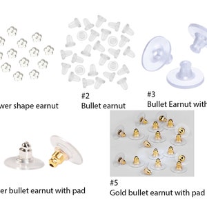 May include: Assortment of earring backs in various styles, including flower-shaped, bullet-shaped, and bullet-shaped with a pad. Some are clear plastic, while others have a silver or gold finish.