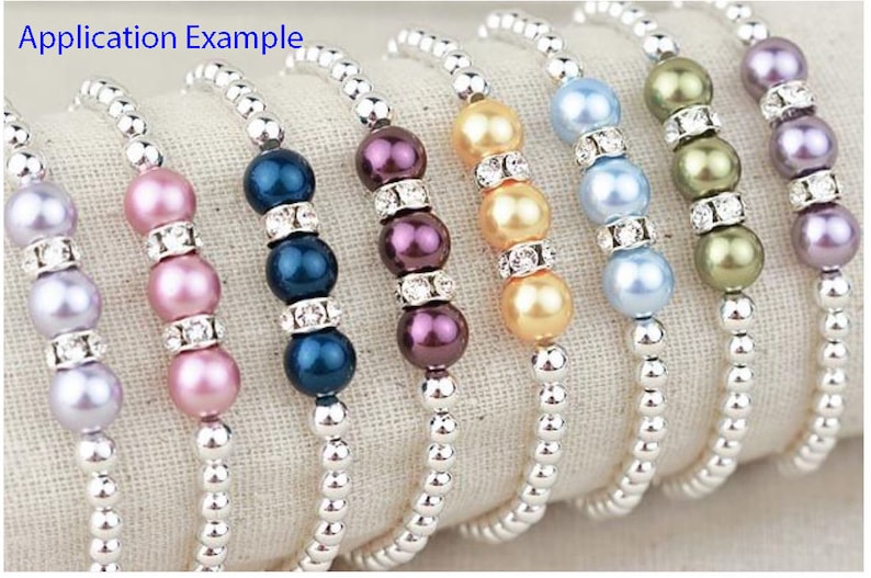 May include: A set of six bracelets with silver chain and pearl beads in various colors, including lavender, pink, blue, purple, gold, and green.