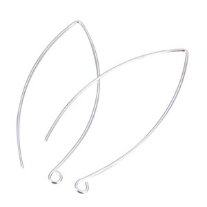 May include: A pair of silver-toned earring hoops with a teardrop shape.