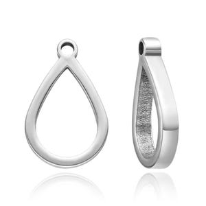 May include: Two silver teardrop-shaped pendant bails with a loop at the top for attaching a chain or cord.