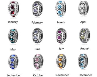 May include: Twelve silver charm beads with different coloured crystals, representing each month of the year. January is red, February is purple, March is blue, April is white, May is teal, June is light blue, July is pink, August is yellow, September is blue, October is pink, November is orange, and December is light blue.