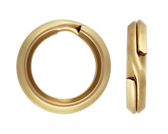 May include: Gold-toned metal jump ring with a slightly open design. The ring is shown from two angles.