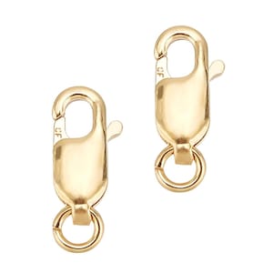 May include: Two gold-toned lobster claw clasps with a spring-ring closure. The clasps are made of metal and have a polished finish.