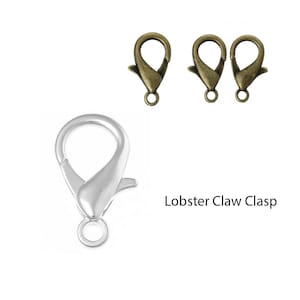 May include: Two antique gold lobster claw clasps and one silver lobster claw clasp. Lobster Claw Clasp.