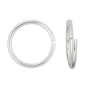 May include: Silver jump ring with a gap for attaching jewelry findings.