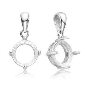 May include: Two silver pendant settings for a round gemstone. The settings have a smooth, polished finish and a delicate, intricate design.