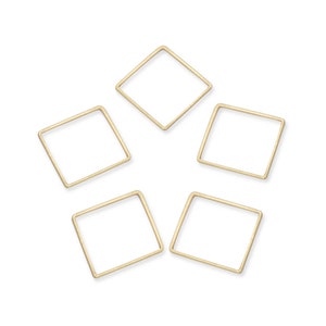 May include: Five gold-colored metal square jump rings. The rings are all the same size and shape.