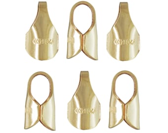 May include: Six gold-colored metal findings, each with a teardrop shape and a loop at the top. The findings have a curved bottom and a small marking that reads "1/2 2014K0". These findings are likely used in jewelry making or crafts.