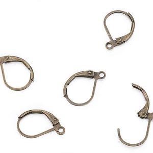 May include: Five antique gold-toned earring hooks. The hooks are made of metal and have a spring-loaded clasp.