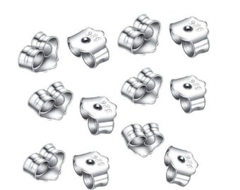 May include: Twelve silver earring backs, each with a 925 stamp, designed to secure earrings in place.
