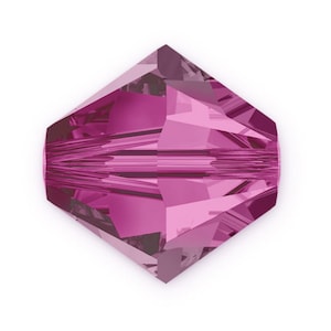 May include: A single faceted pink crystal bead with a square shape.