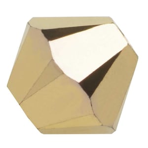 May include: A gold-colored faceted bead with a geometric shape.