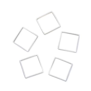 May include: Five silver-toned metal square rings, each at a slightly different angle, are arranged on a white background.