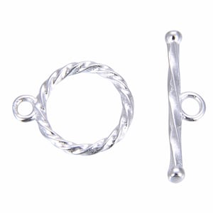 May include: Silver-toned twisted toggle clasp with a round ring and a straight bar. The ring and bar are both twisted.