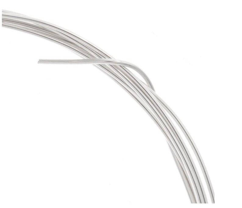 May include: A roll of silver wire, perfect for jewelry making or crafting projects.