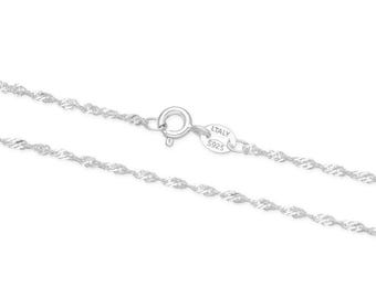 May include: A silver chain necklace with a twisted rope design. The chain has a lobster clasp and a tag that reads "ITALY 925".