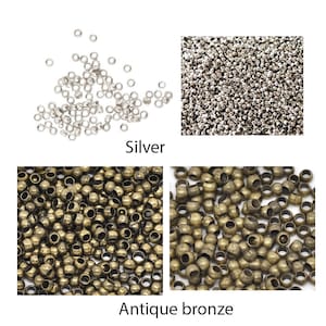 May include: Two close-up images of small round metal beads. The first image shows silver beads. The second image shows antique bronze beads.