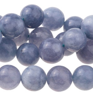 May include: A strand of light blue gemstone beads. The beads are round and smooth, with a slightly translucent appearance.