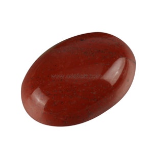 May include: A smooth, oval-shaped red jasper stone with a polished finish. The stone has a deep red color with subtle brown and black flecks throughout.