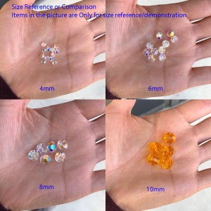 May include: Four sets of clear glass beads in different sizes. The beads are arranged in a hand. The beads are 4mm, 6mm, 8mm, and 10mm in size. The text 'Size Reference or Comparison' and 'Items in the picture are Only for size reference/demonstration' are at the top of the image. The text '4mm', '6mm', '8mm', and '10mm' are below each set of beads.