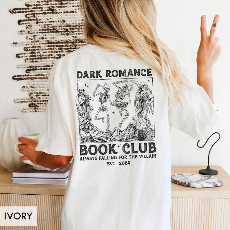 a woman wearing a book club t - shirt