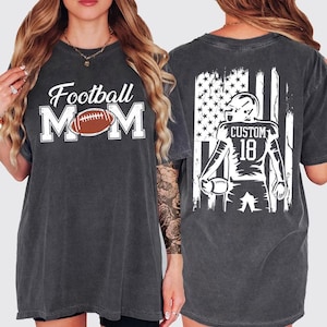 A woman wearing a grey t-shirt with the text "Football Mom" printed on it, along with an image of a football player.