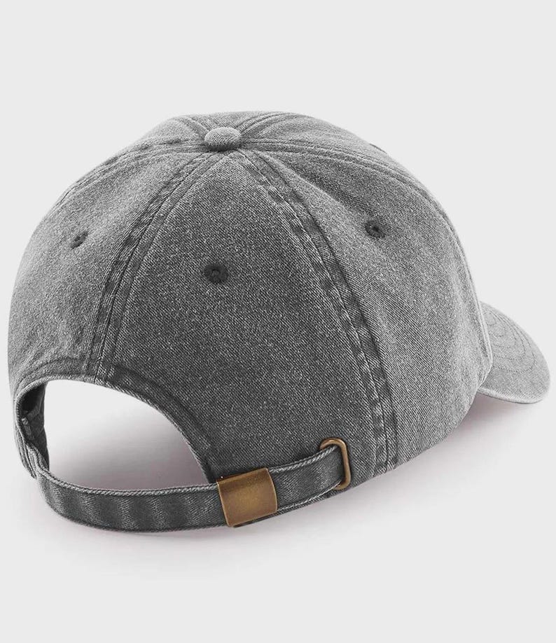 A gray, vintage-style baseball cap with a metal buckle.