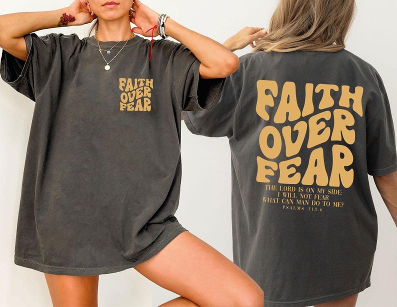 a woman wearing a faith over fear t - shirt