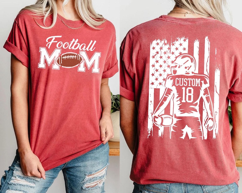 A red t-shirt with the text "Football Mom" printed on it, along with an image of a football player wearing a helmet with the number 18.