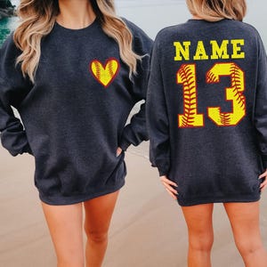 a couple of women standing next to each other on a beach
