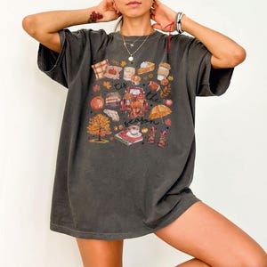 a woman posing for a picture wearing a t - shirt