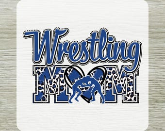 May include: A white sublimation transfer with the words "Wrestling Mom" in blue and black. The word "Mom" has a leopard print design. A blue silhouette of two wrestlers is in the center. The words "DTF Transfers" and "READY To PRESS" are also in the image.