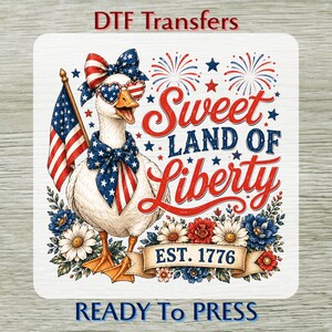 May include: A square DTF transfer featuring a white goose wearing a star-patterned bow and heart-shaped sunglasses, holding an American flag. The text reads Sweet LAND OF Liberty EST. 1776, surrounded by red, white, and blue flowers and fireworks.