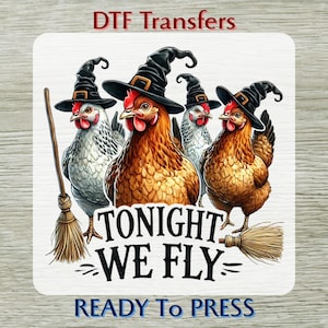 May include: A DTF transfer design featuring four chickens wearing witch hats and holding brooms. The text "TONIGHT WE FLY" is displayed below the chickens, with "READY TO PRESS" at the bottom. The design is on a white background.
