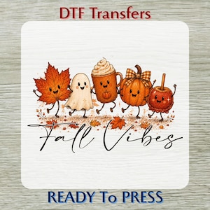 May include: A DTF transfer sheet featuring a cartoon illustration of a smiling orange maple leaf, a white ghost, a coffee mug with whipped cream, a pumpkin with a plaid bow, and a red candy apple. The text reads DTF Transfers, Fall Vibes, READY To PRESS.