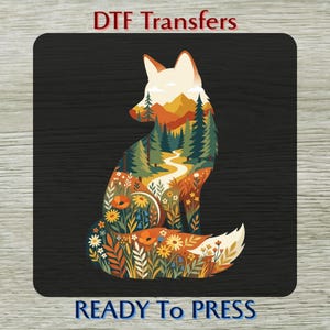 May include: A DTF transfer featuring a fox silhouette filled with a landscape design. The fox is colored with orange, green, and yellow hues, with a mountain and forest scene. The text "DTF Transfers" and "READY To PRESS" are displayed.