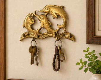 Gancio da parete vintage in ottone a forma di delfini: decorazione nautica e costiera