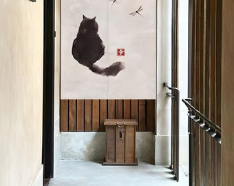May include: A black cat silhouette with a long tail is printed on a white fabric room divider. Two dragonfly silhouettes are also printed on the divider. The divider is hanging in a hallway with a wooden floor and a wooden box.